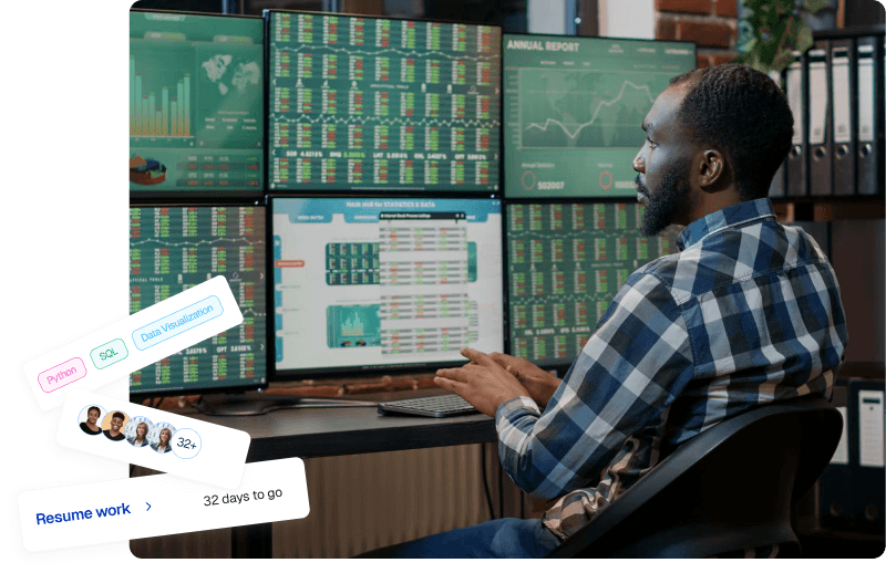 Person analyzing data on multiple monitors